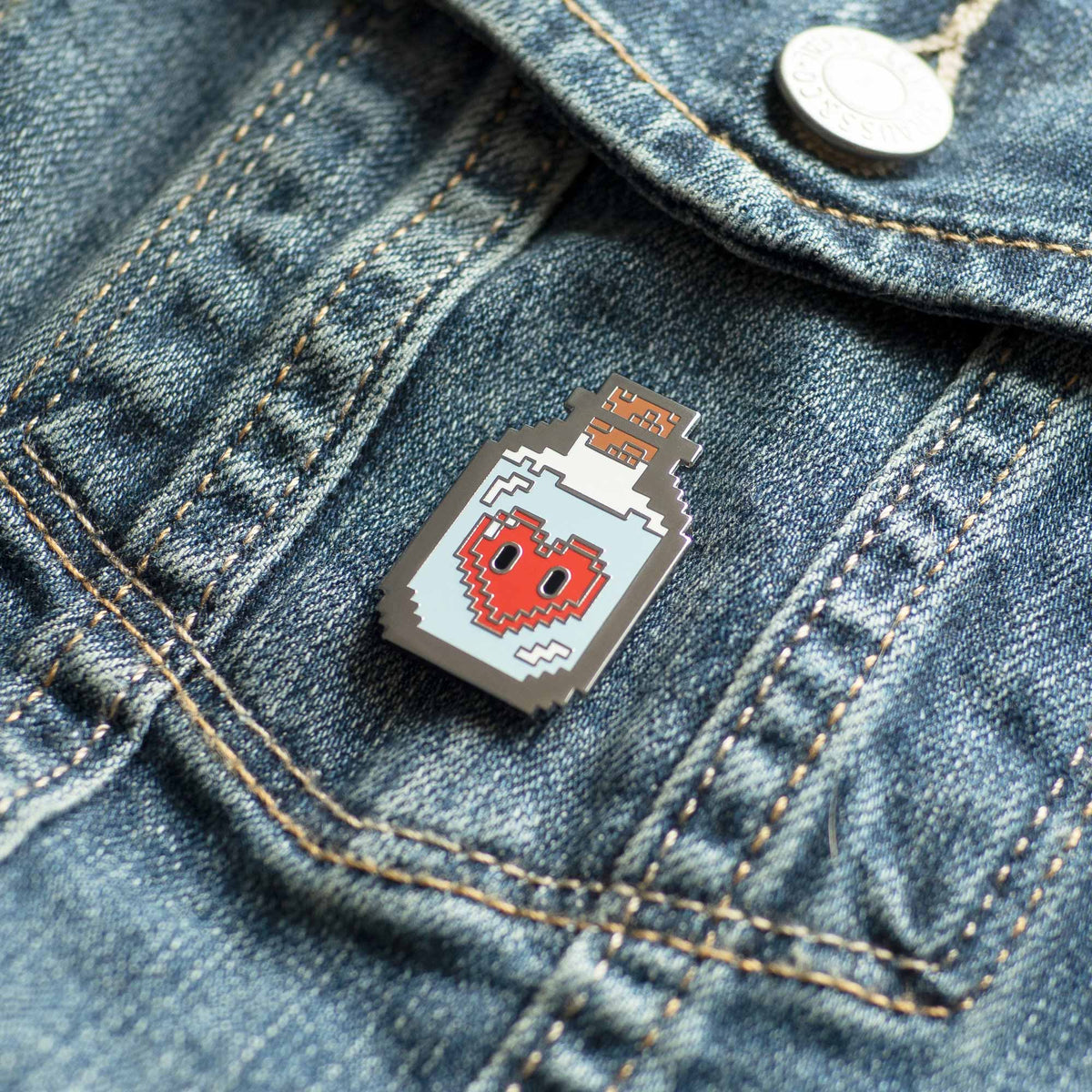 8-Bit Love Potion hard enamel pin on denim jacket
