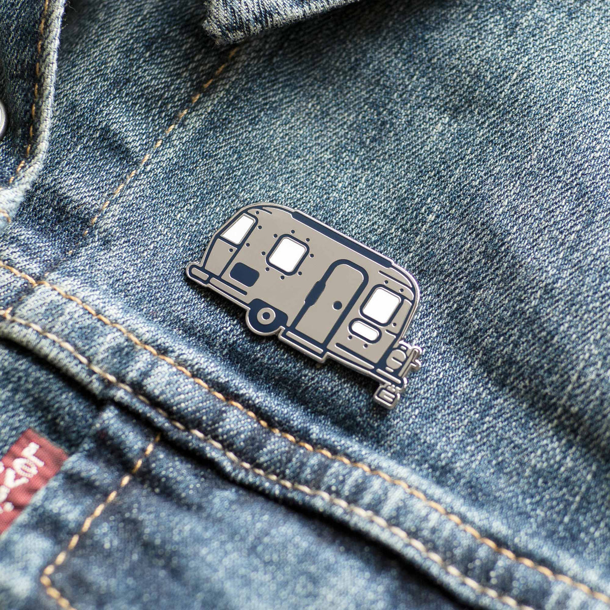 Happy Camper Vintage Airstream hard enamel pin on denim jacket