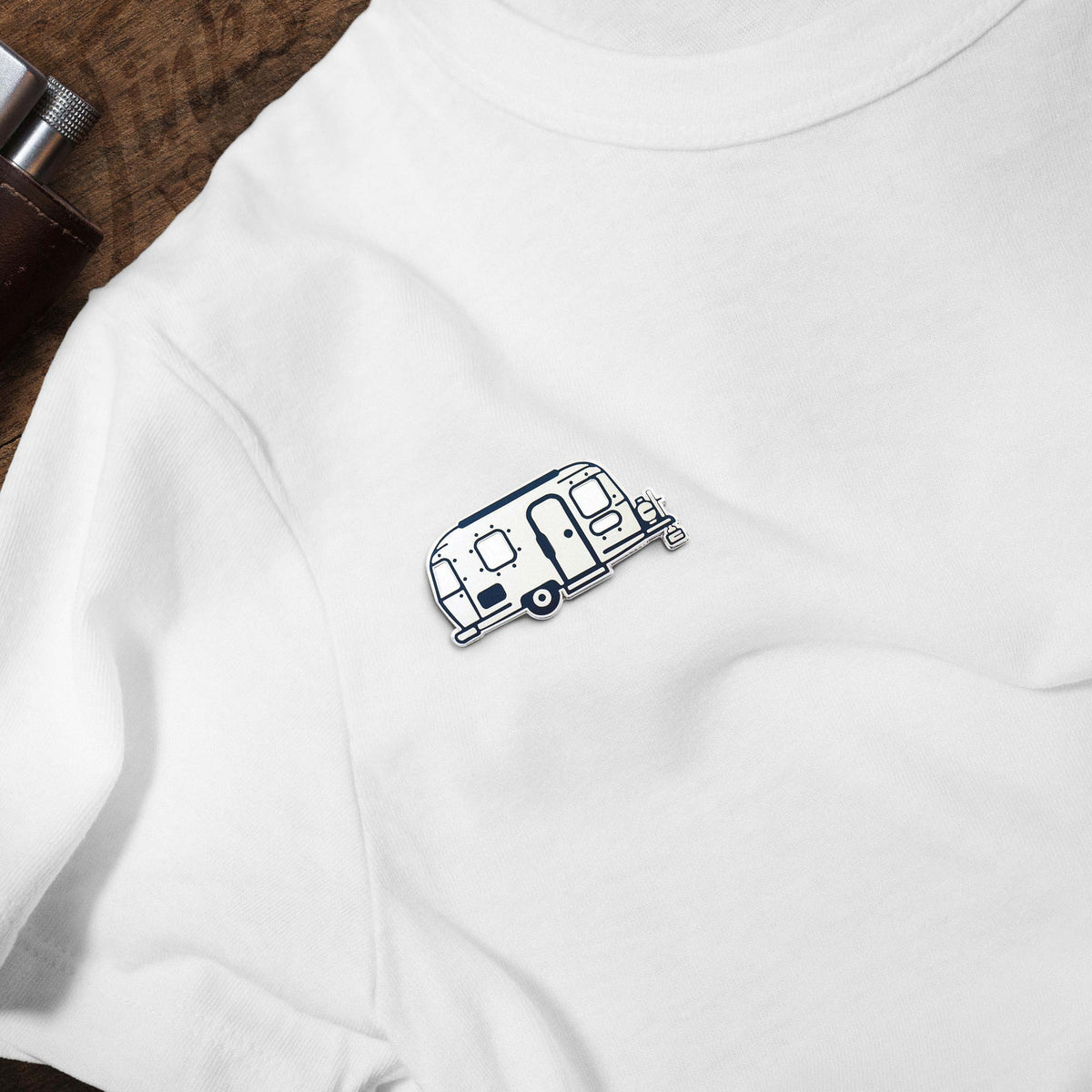 Happy Camper Vintage Airstream hard enamel pin on white t-shirt