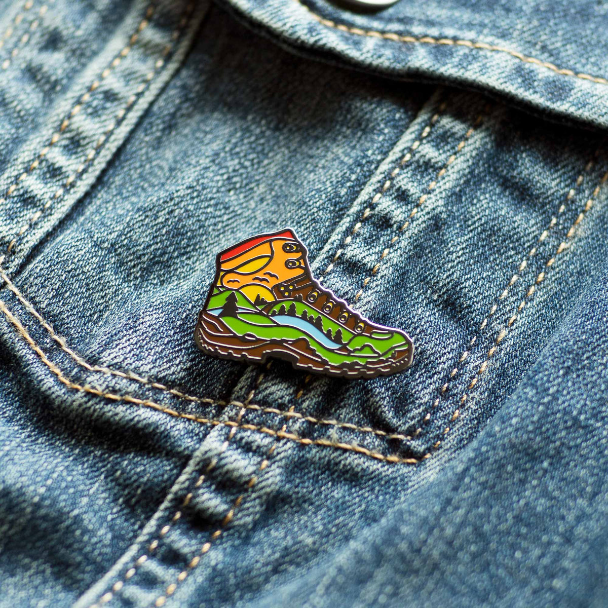 Hiked It Liked It Hiking Boot hard enamel pin on denim jacket
