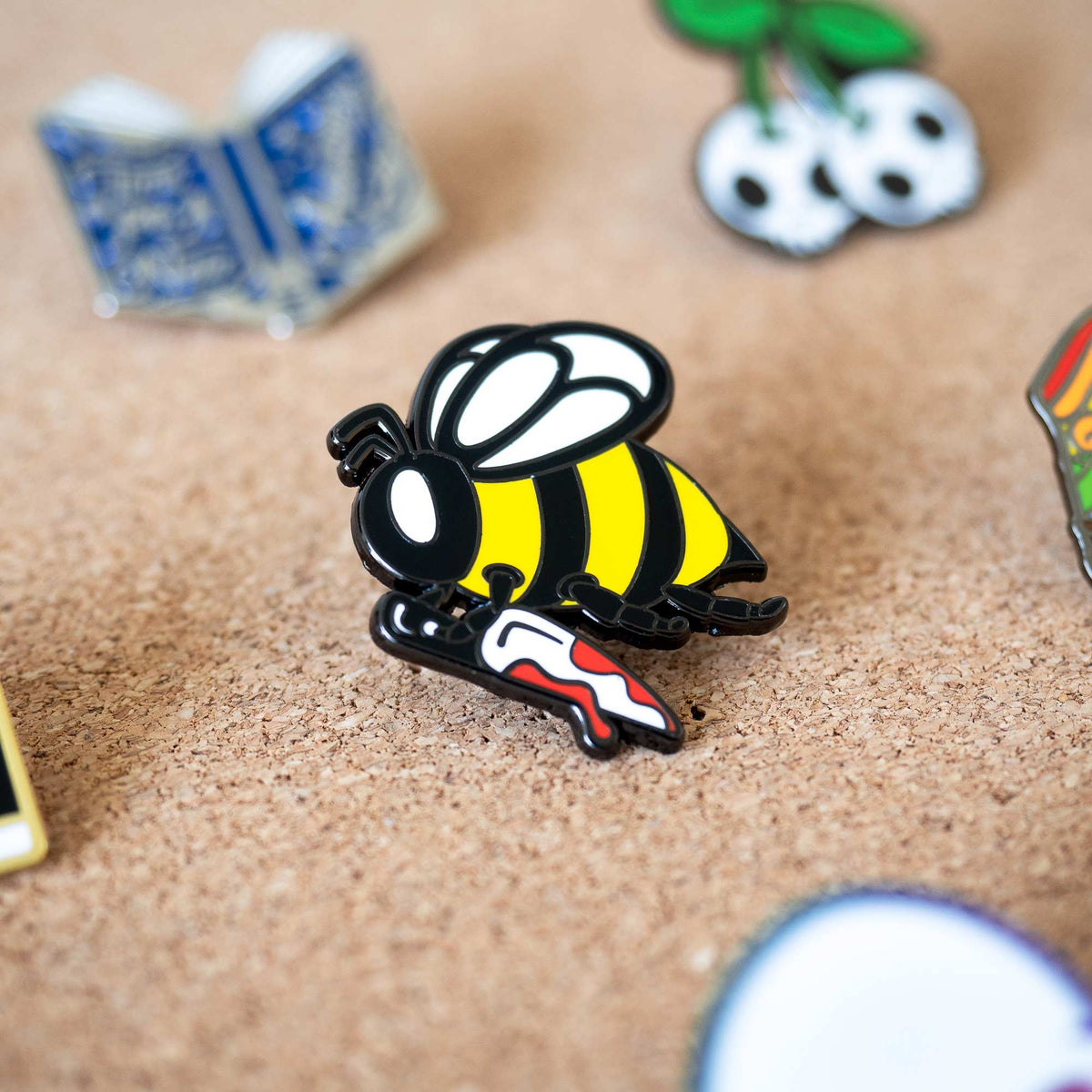 Killer Bee Holding Knife hard enamel pin