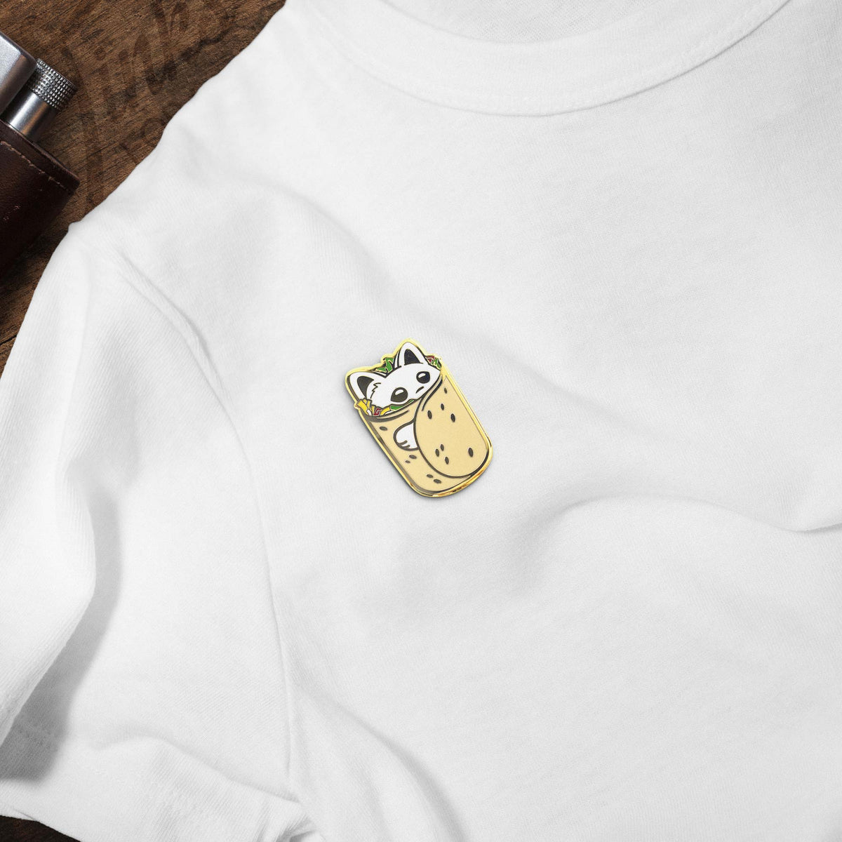 Purrito Burrito Cat hard enamel pin on white t-shirt