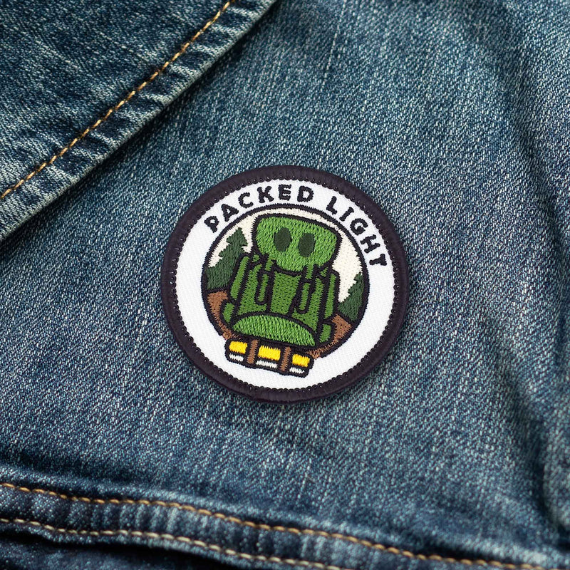 Packed Light Backpacking individual adulting merit badge patch for adults on denim jacket