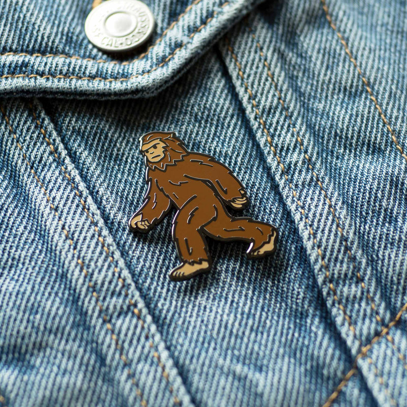 Bigfoot Sasquatch hard enamel pin on denim jacket