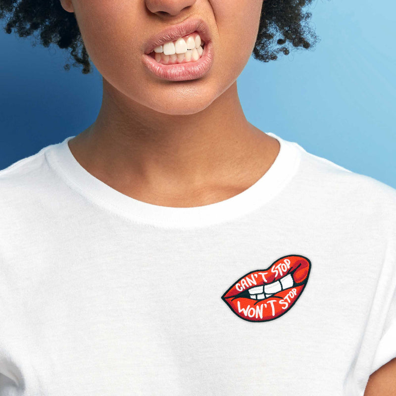 Can't Stop Won't Stop patch on white t-shirt