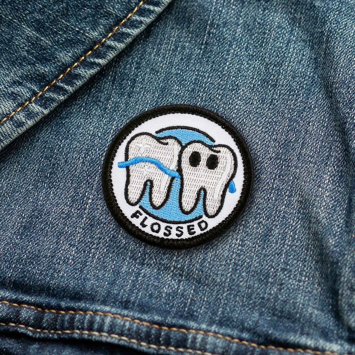 Flossed adulting merit badge patch for adults on denim jacket