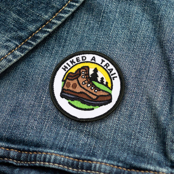 Hiked A Trail adulting merit badge patch for adults on denim jacket