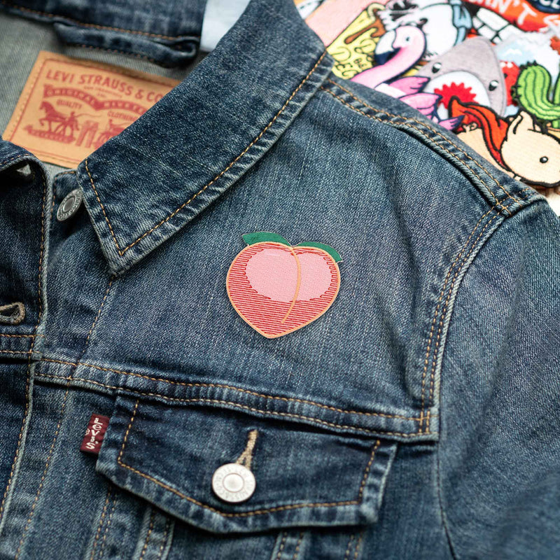 Peach Emoji patch on denim jacket