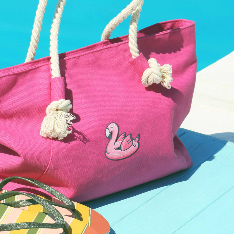 Pink Flamingo Floatie patch on pink bag by the swimming pool