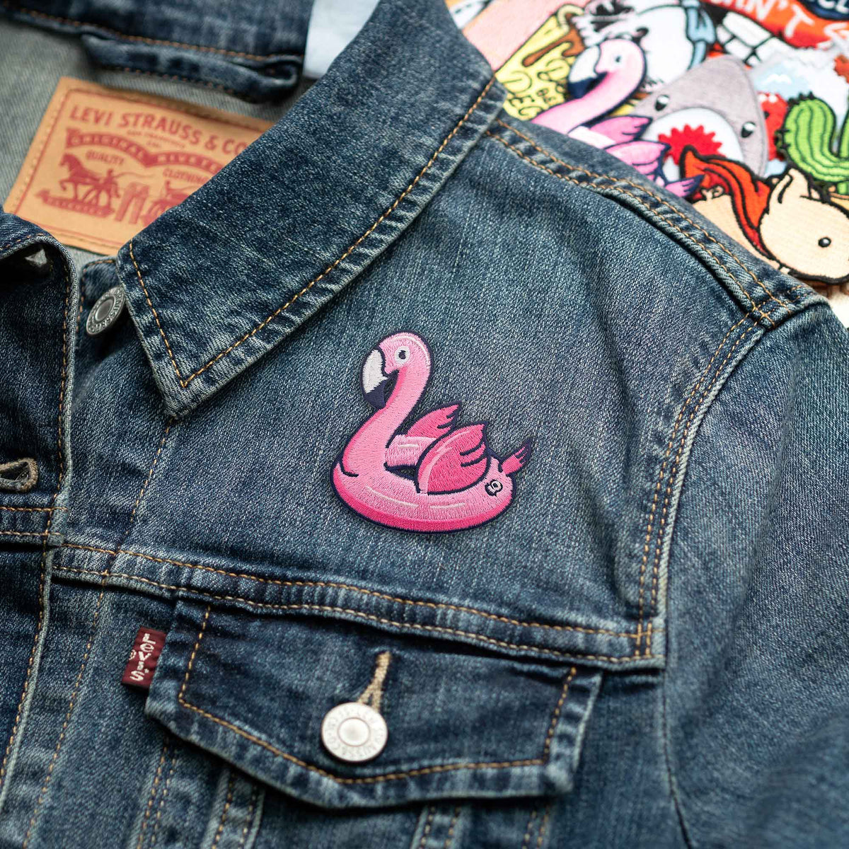 Pink Flamingo Floatie patch on denim jacket