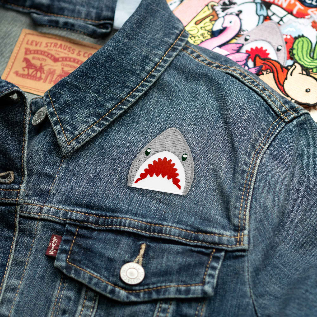 Shark Emoji patch on denim jacket